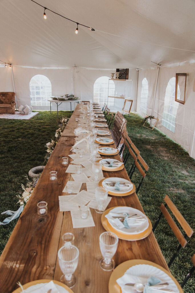 Rustic outdoor wedding reception tables and decor
