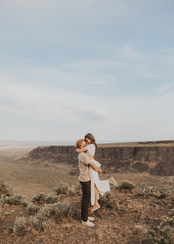 Couple posing for photos at Frenchman Coulee. Captured by WA Engagement Photographer - Kat Nielsen