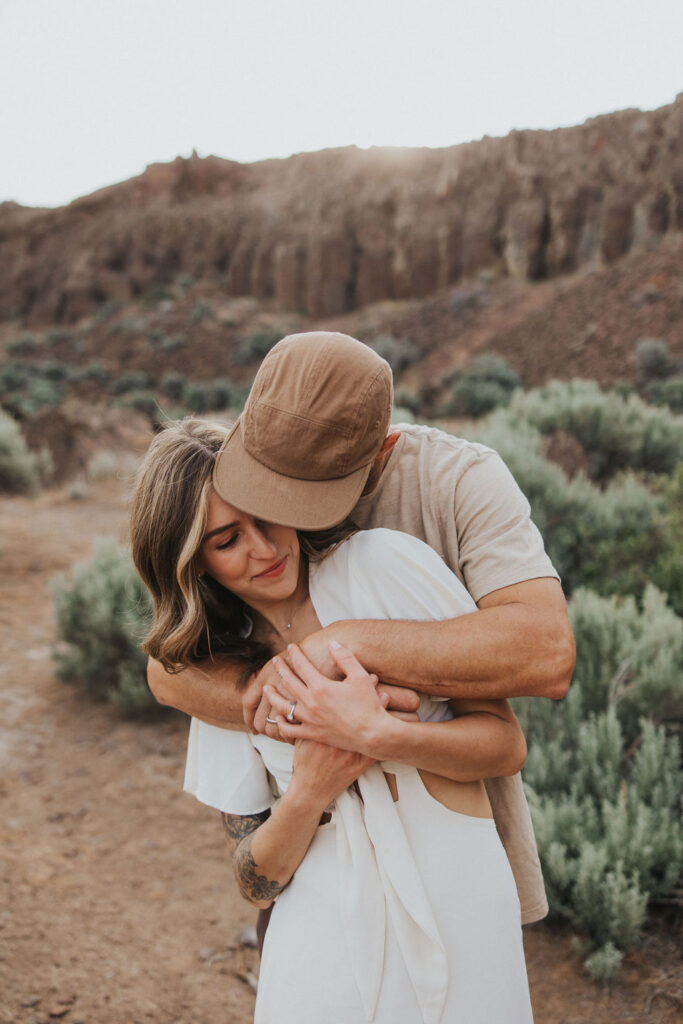 Couple posing for photos at Frenchman Coulee. Captured by WA Engagement Photographer - Kat Nielsen