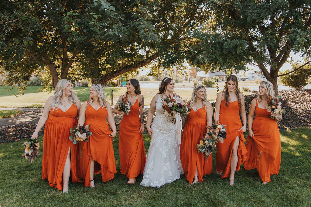 Bride and bridesmaids, bridesmaids terracotta dresses