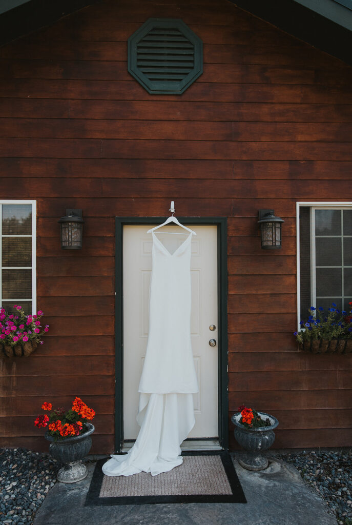 Wedding dress hanging on the door