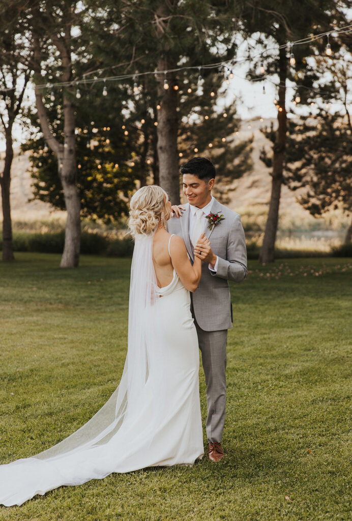 Bride and groom first dance at riverside wedding venue in WA