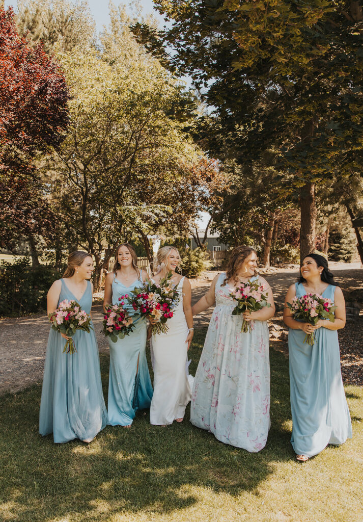 Bride and bridesmaids, blue mismatched bridesmaids dresses