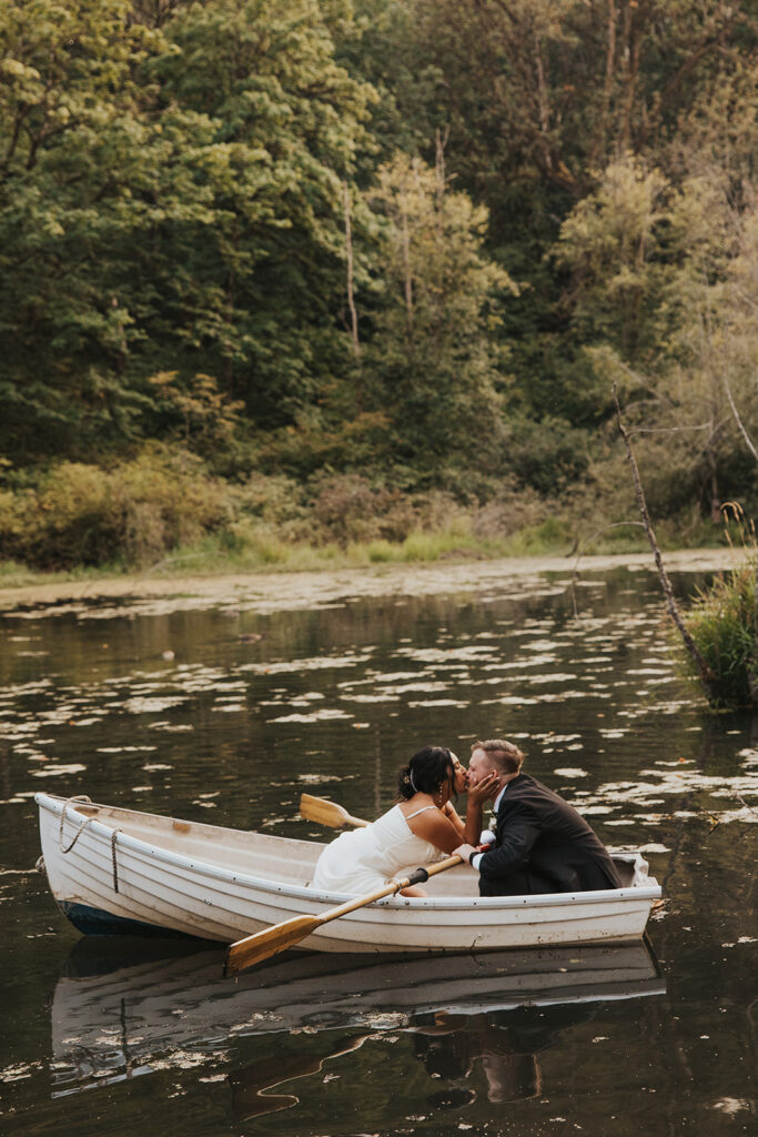 romantic wedding portrait in a row boat
