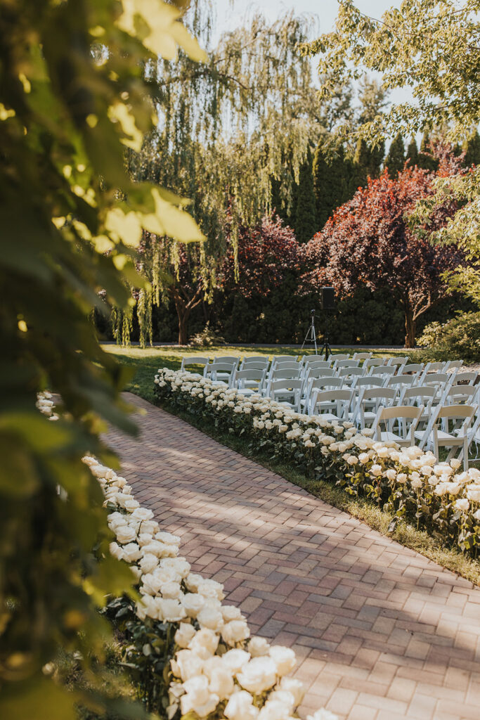 elegant garden ceremony set up with white roses