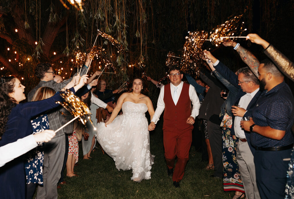 Outdoor wedding reception sparkler exit