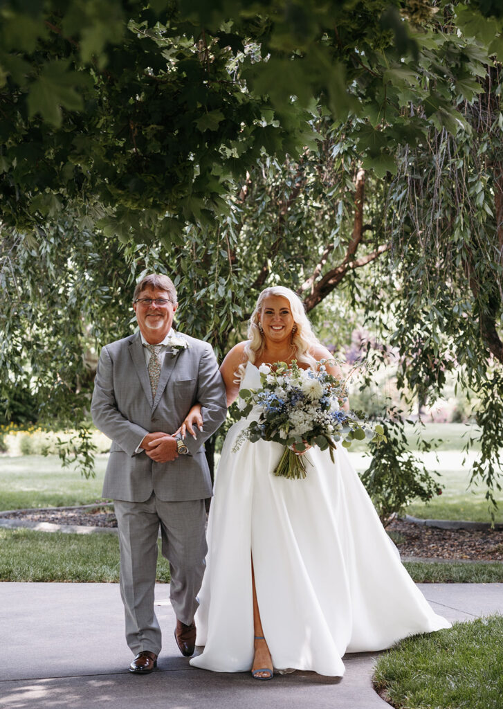 Samantha and her father joyfully walking down the aisle