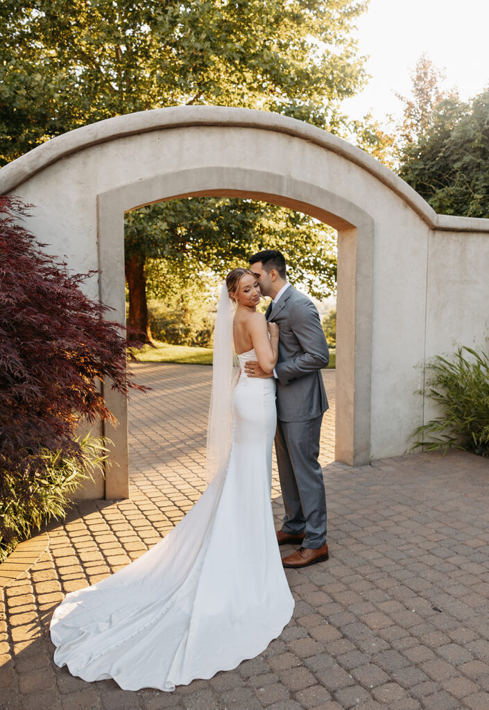 Terra Blanca Winery’s sun-soaked vineyards provide a stunning backdrop for a summer wedding portrait.