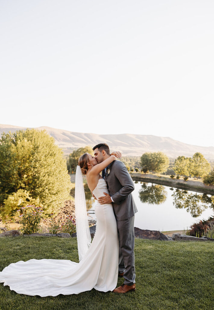 Terra Blanca Winery’s sun-soaked vineyards provide a stunning backdrop for a summer wedding portrait.