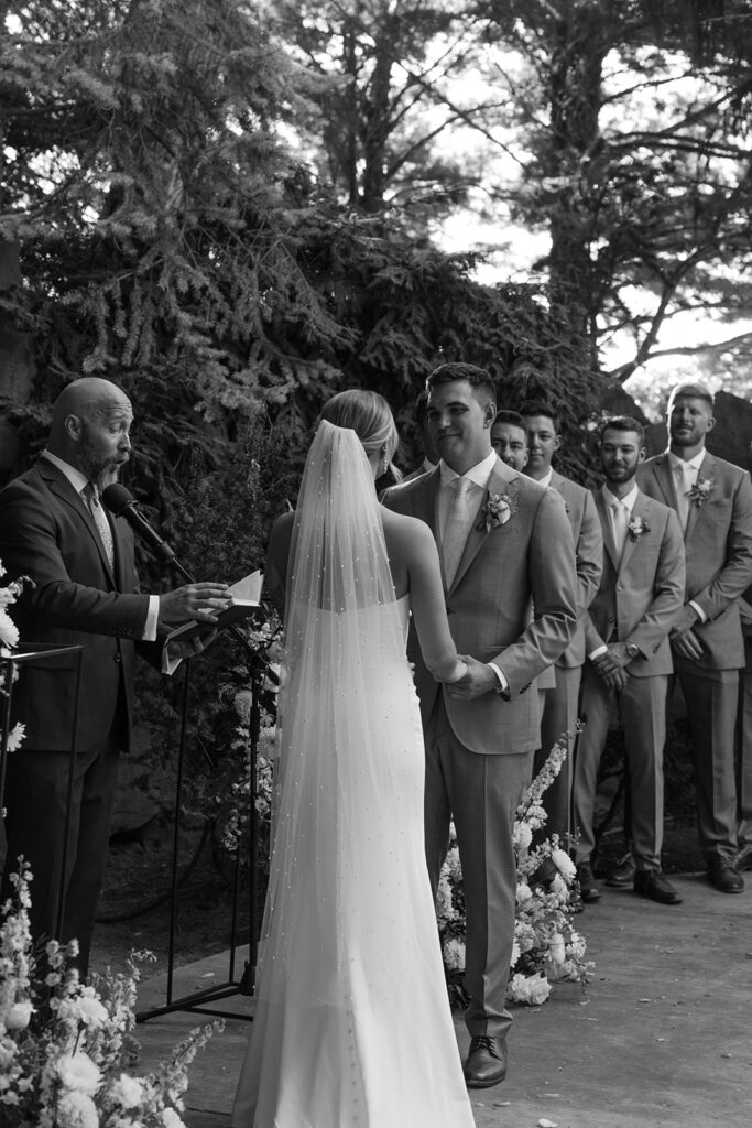 Romantic wedding ceremony at Terra Blanca Winery, surrounded by elegant blue and white florals.