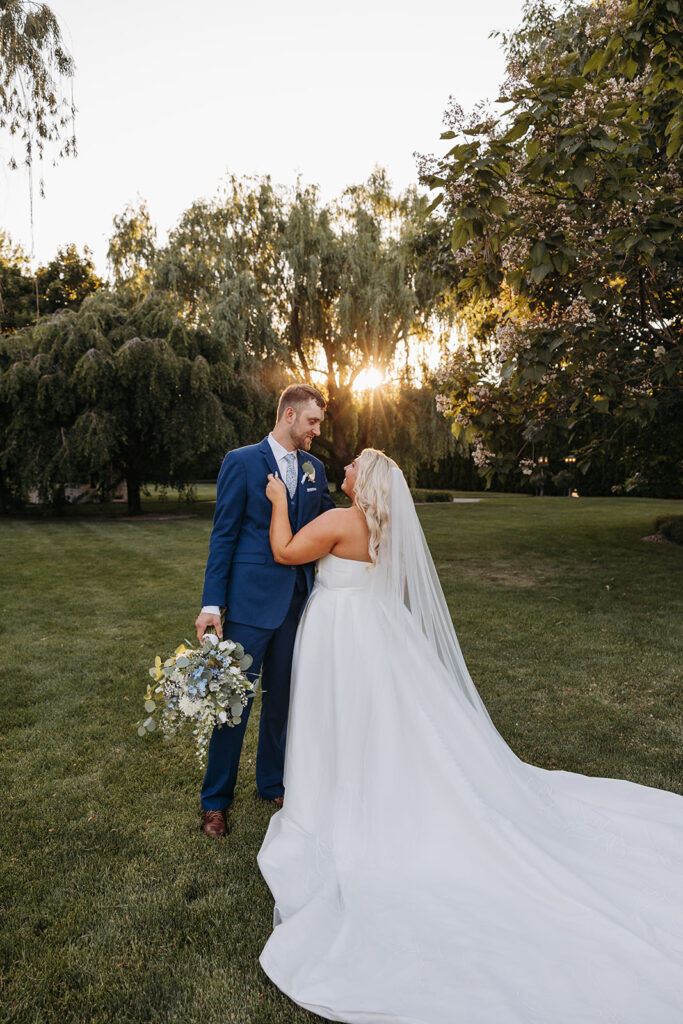 The sun setting behind Samantha and Austin as they share a private moment in the Promise Garden.