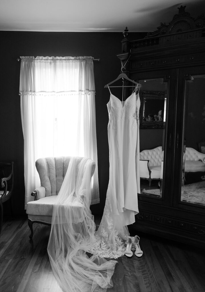 Bride's gown hangs in the bridal suite of The Moore Mansion