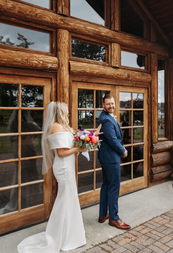 Bride and groom, first look in front of Kiana Lodge