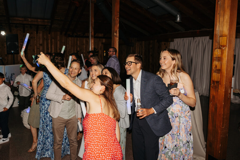 Bride and groom party with their wedding guest during the reception at Kiana Lodge