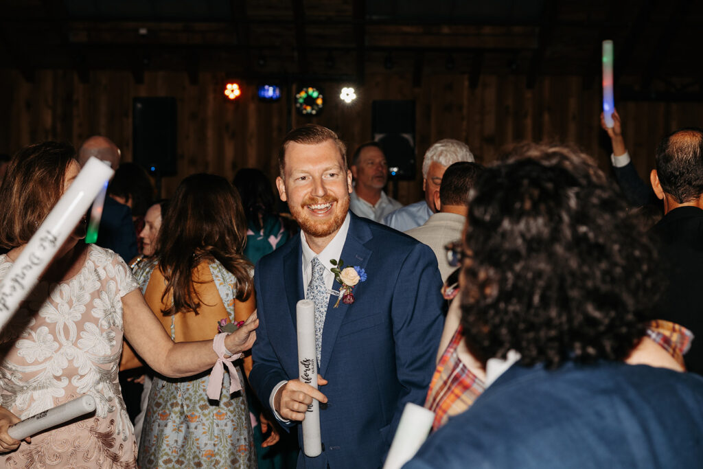 Bride and groom party with their wedding guest during the reception at Kiana Lodge