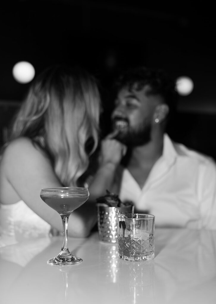 Classy and flirty bar engagement photos with cocktails