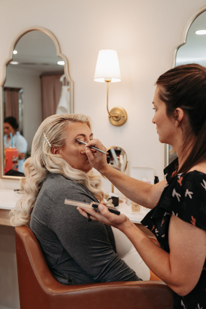 Bride gets her makeup down in the Promise Garden bridal suite
