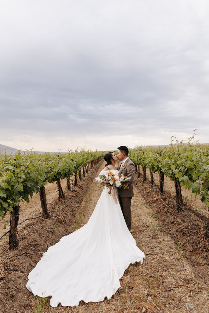 Bride and groom portraits in Terra Blanca Winery's vineyard