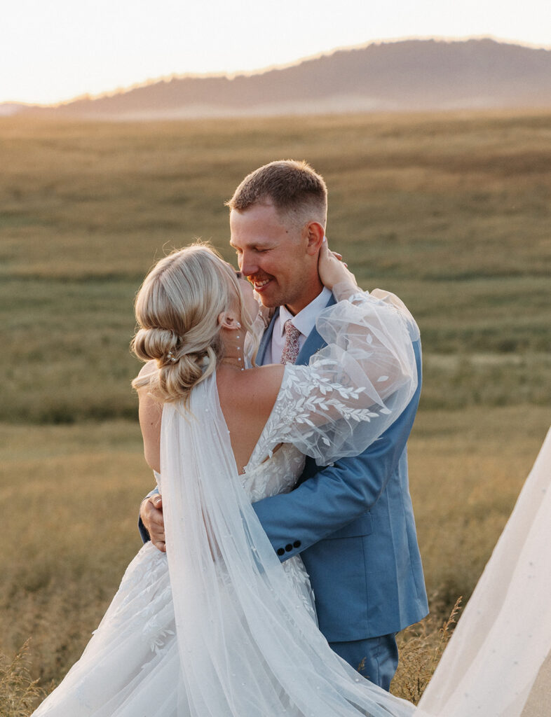 Sunset wedding portraits in a field by The Greenhouse on Harvard