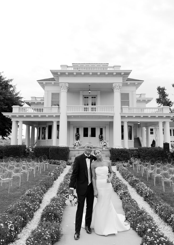 Bride and groom photos in front of The Moore Mansion