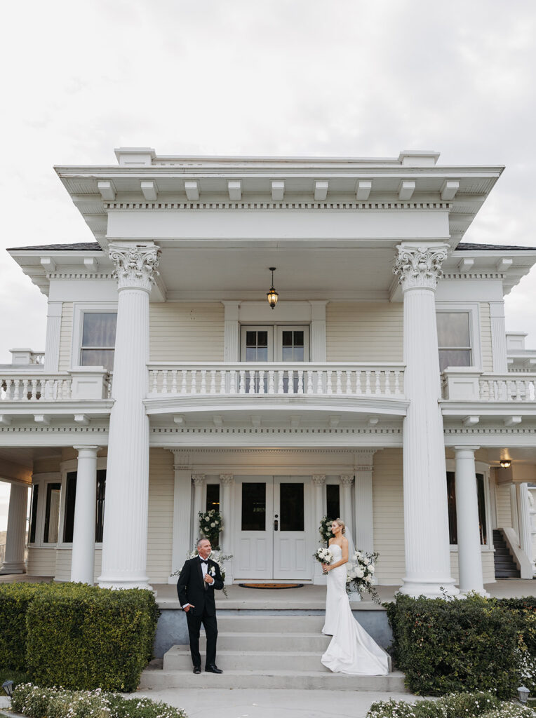 Bride and groom photos in front of The Moore Mansion