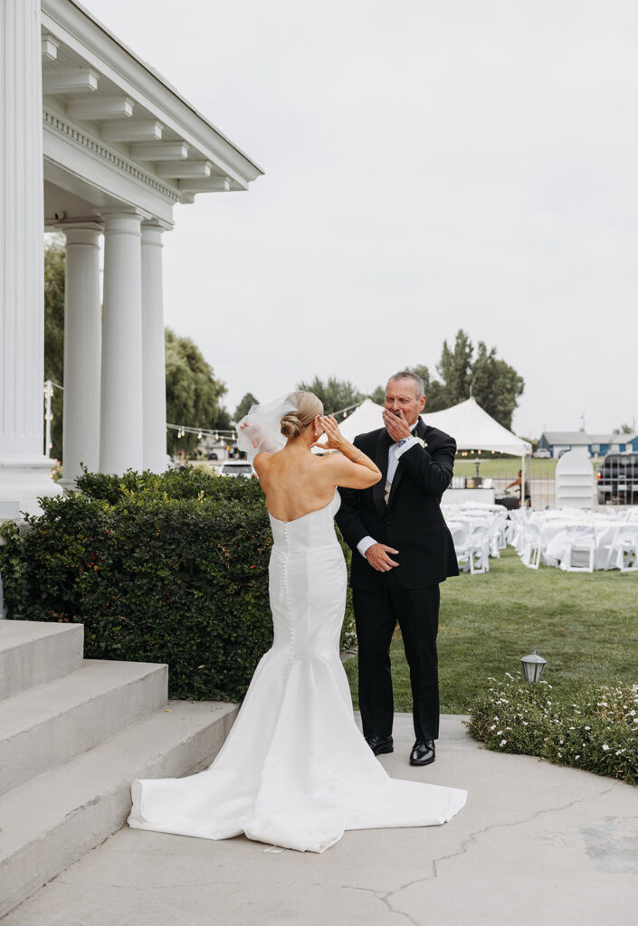 An emotional first look in front of a Tri-Cities wedding venue: The Moore Mansion