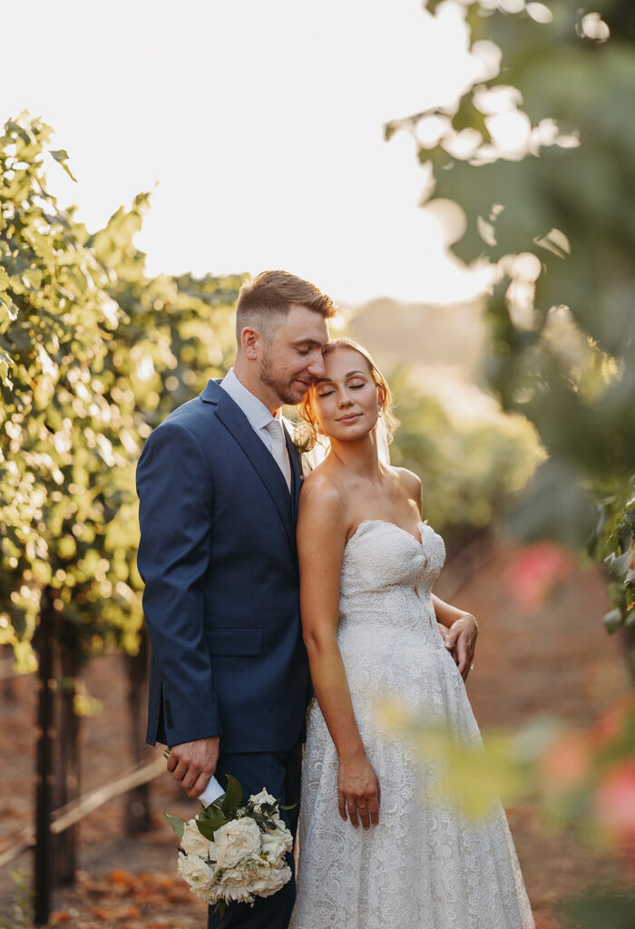 Golden hour bride and groom portraits in the Sugar Pine Barn vineyard