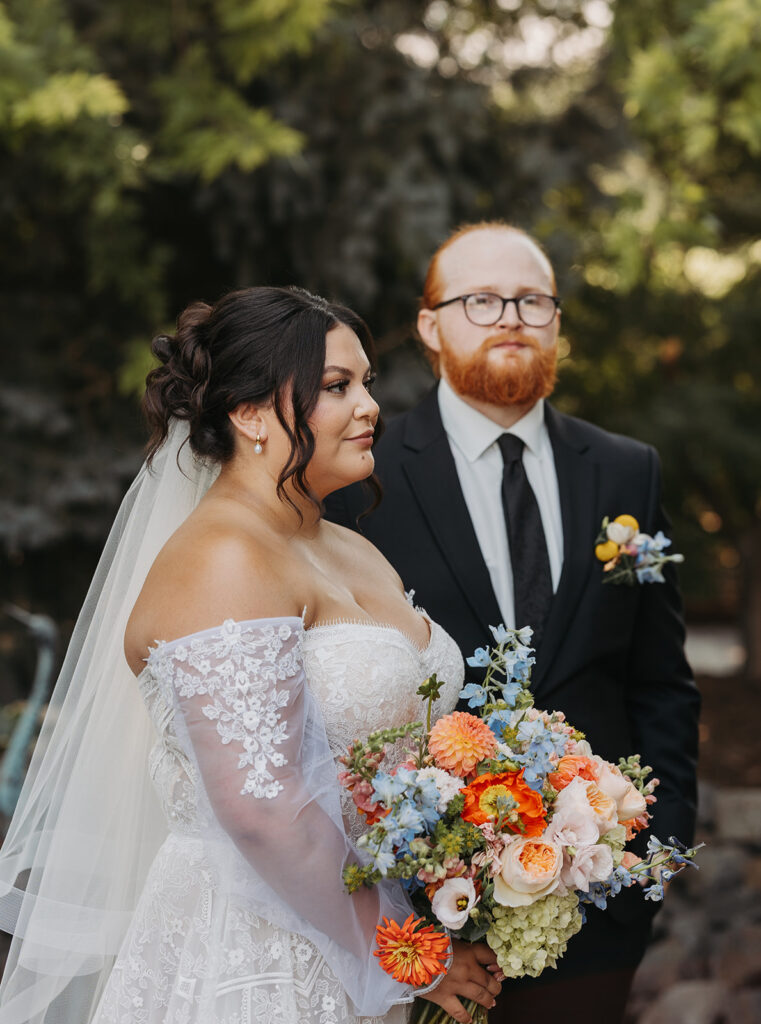 Dreamy bride and groom photos with colorful bouquet at a Washington barn wedding venue