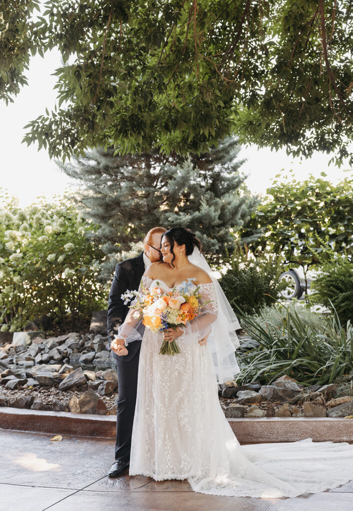 Dreamy bride and groom photos with colorful bouquet at a Washington barn wedding venue