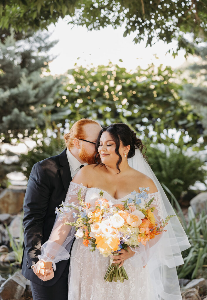 Dreamy bride and groom photos with colorful bouquet at a Washington barn wedding venue