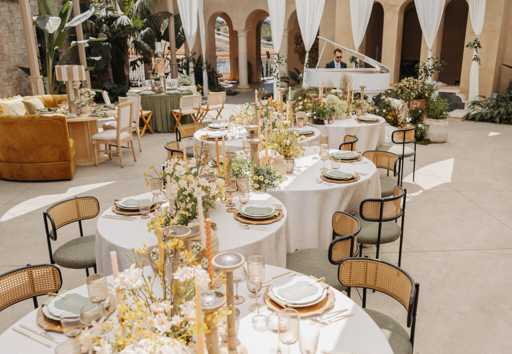 Editorial wedding reception setup with round tables, layered linens, floral centerpieces, and soft natural light during a Southern Bride shoot in Temecula, California.
