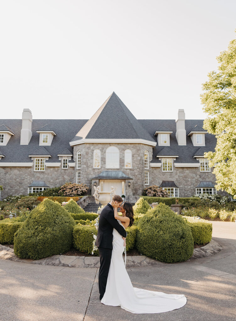 Bride and groom portraits in front of Château de Michellia in Oregon