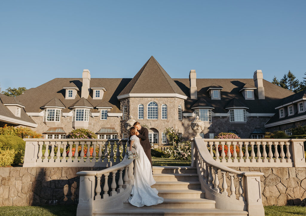 Bride and groom portraits in front of Château de Michellia in Oregon