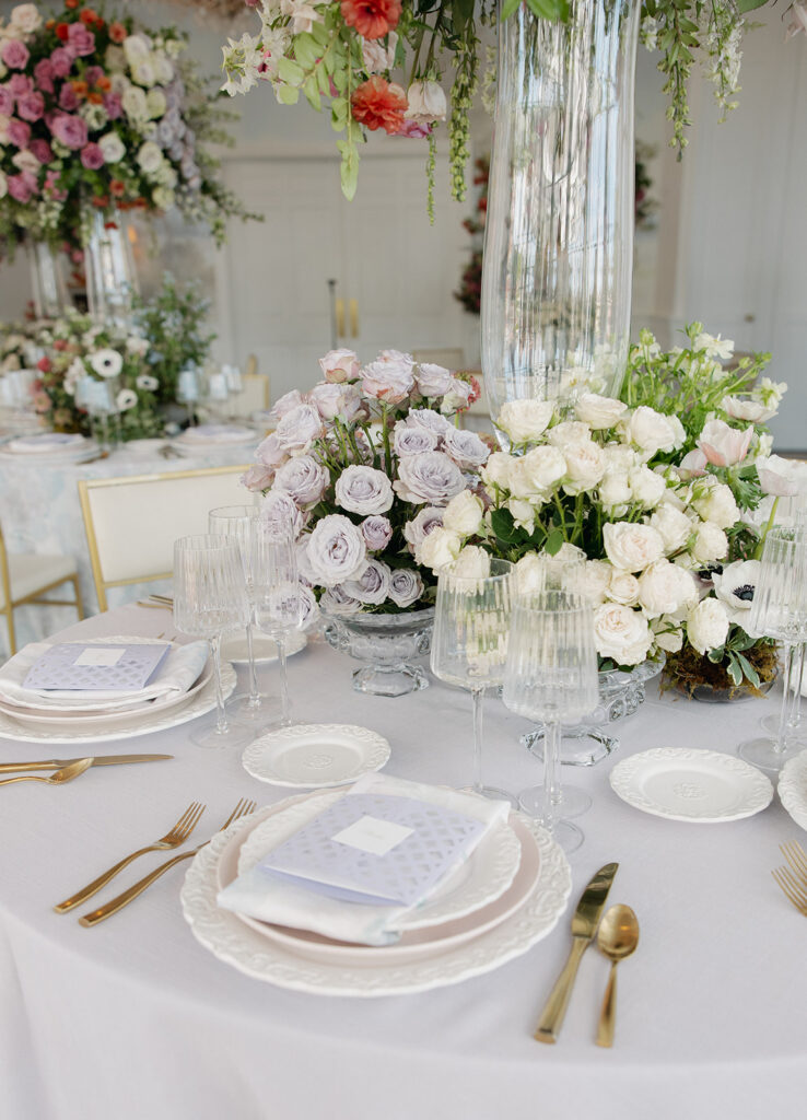 Floral-forward luxury wedding table settings at Sherwood Country Club