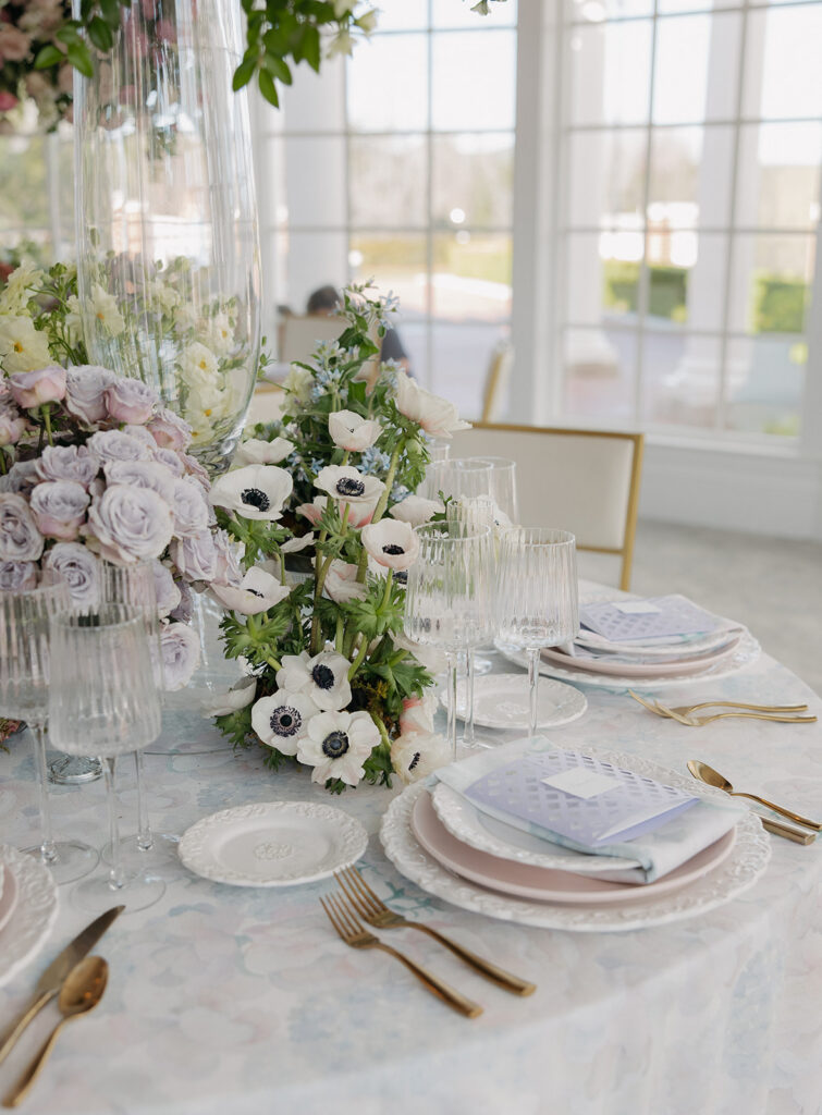 Floral-forward luxury wedding table settings at Sherwood Country Club